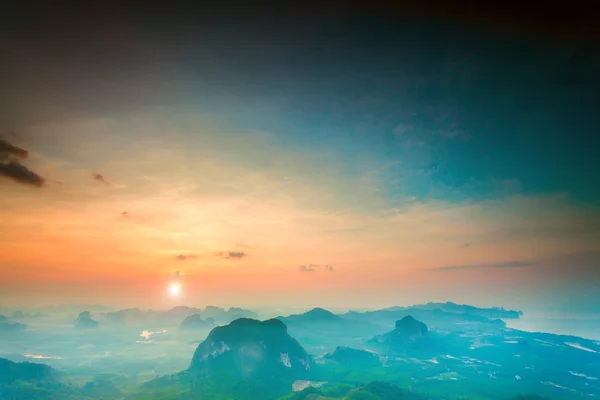 Mountains under colorful sky in sunset — Stock Photo, Image