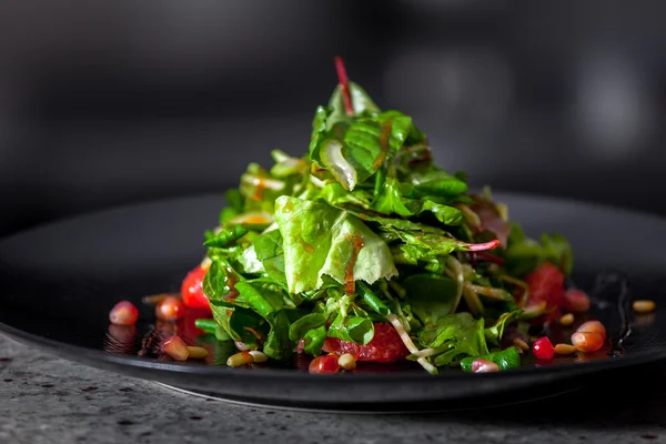 Appetizer with herbs and pomegranate seeds — Stock Photo, Image