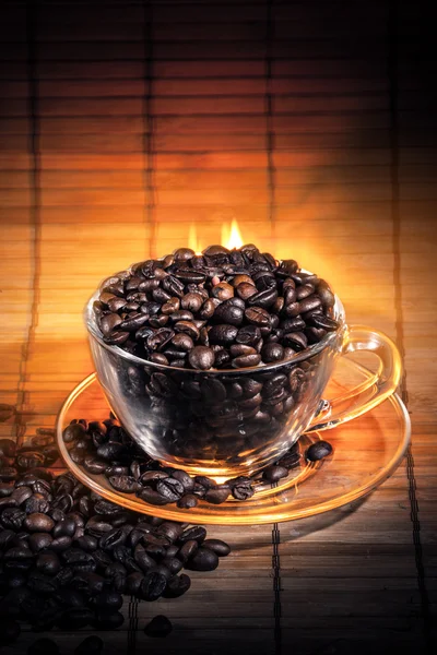 Steaming cup of coffee on fire — Stock Photo, Image