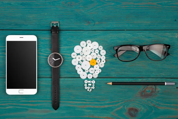 Pomysłem - znak Żarówka, zegarek i telefon na biurku — Zdjęcie stockowe