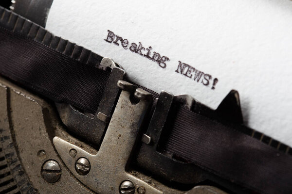 Breaking News text typed on an old typewriter. news time