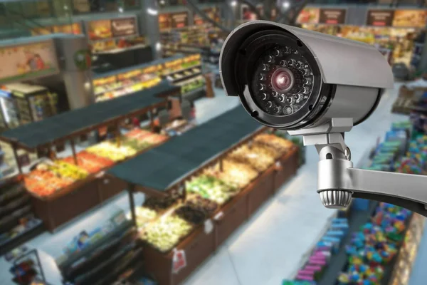CCTV camera system security in shopping mall supermarket blur background.