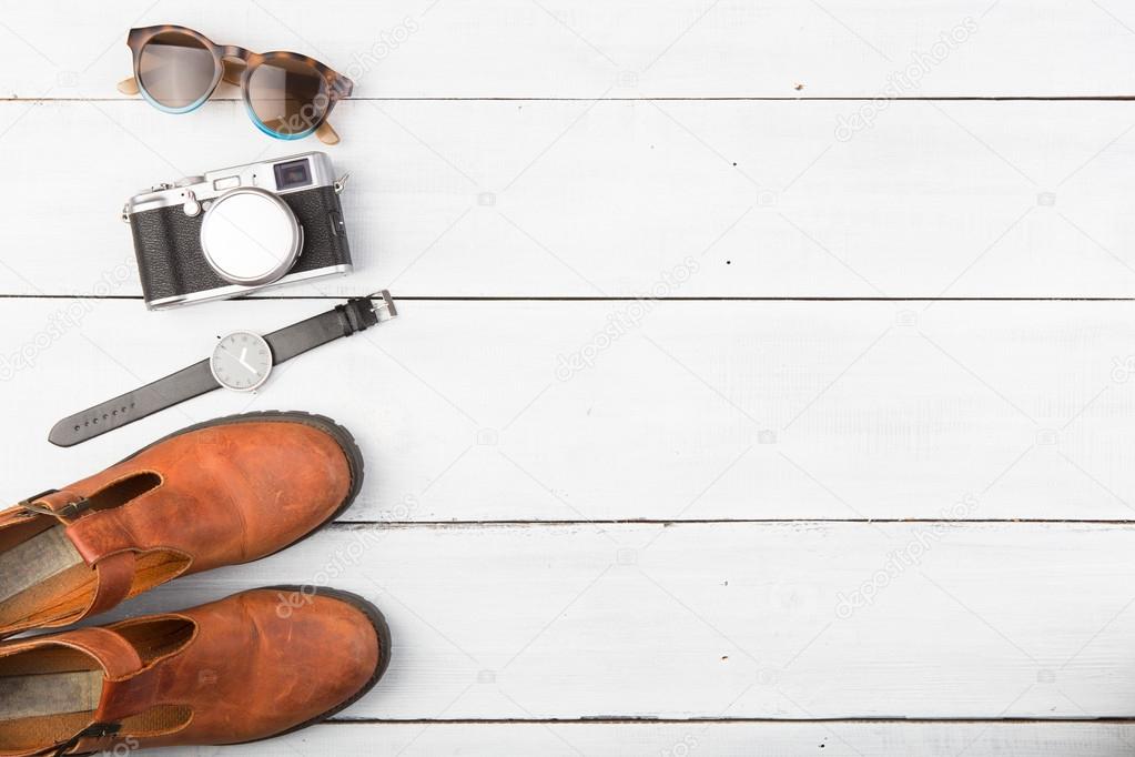 Tourism concept - set of camera, glasses, wathes and shoes 