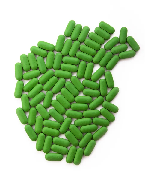 Emberi szív a zöld tablettát — Stock Fotó