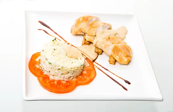 Chicken roll with rice and tomatoes — Stock Photo, Image