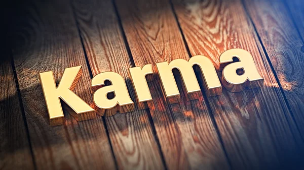 Ordet Karma på trä plankor — Stockfoto