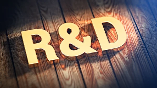 Acrónimo R & D em tábuas de madeira — Fotografia de Stock
