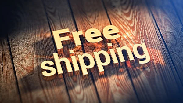 Frazę Free Shipping na desek drewnianych — Zdjęcie stockowe