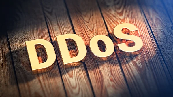 Word Ddos op houten planken — Stockfoto