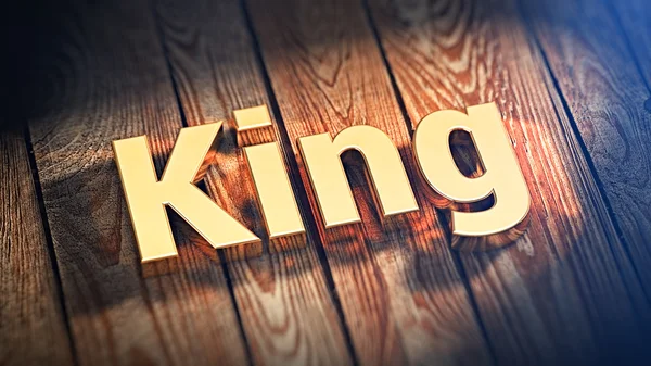 Λέξη βασιλιά στις ξύλινες σανίδες Εικόνα Αρχείου