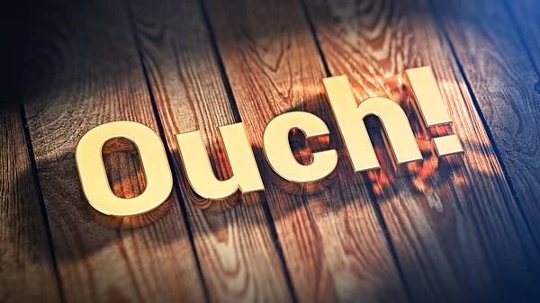 Word Ouch on wood planks — Stock Photo, Image