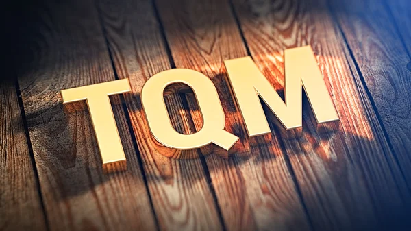 Akronim Tqm na desek drewnianych — Zdjęcie stockowe