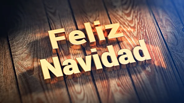 Frase Feliz Navidad em tábuas de madeira — Fotografia de Stock