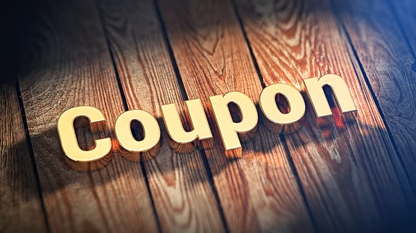 Word Coupon op houten planken — Stockfoto