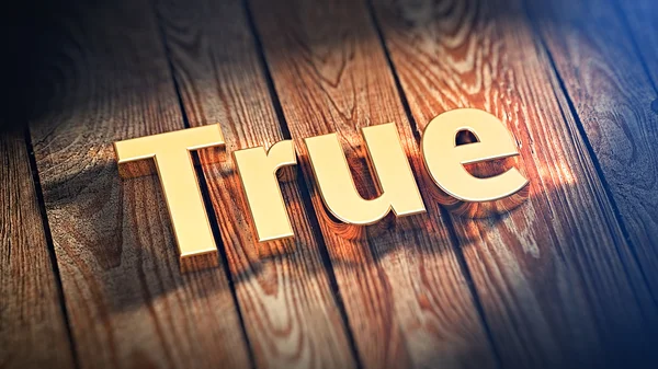 Word True on wood planks — Stock Photo, Image