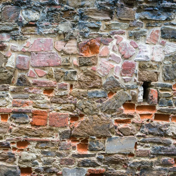 Red bricks and stones wall texture — Stock Photo, Image