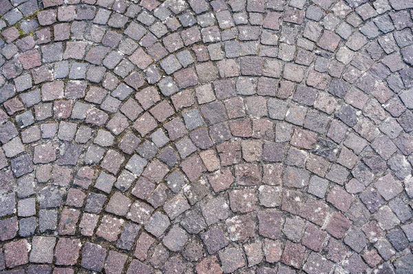 Cobblestones laid in semicircle — Stock Photo, Image