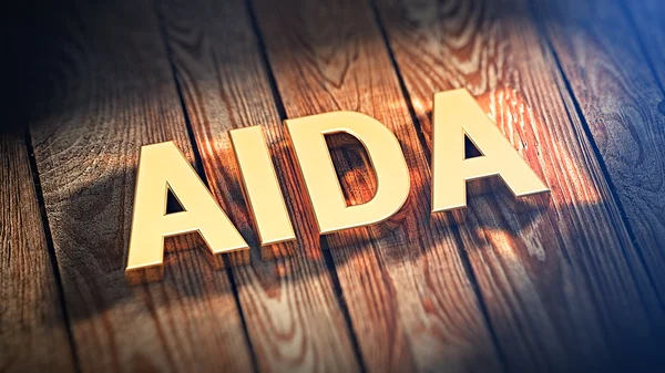 Acrónimo AIDA sobre tablones de madera — Foto de Stock