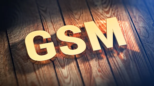 Sigla GSM em tábuas de madeira — Fotografia de Stock