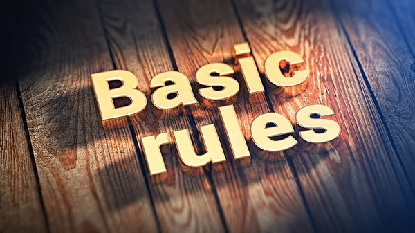 Phrase Basic rules on wood planks — Stock Photo, Image