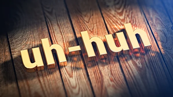 Word uh-huh on wood planks — Stock Photo, Image