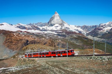 Train near the Gornergrat Bahn Railway, a mountain rack railway near Zermatt town in the Valais canton of Switzerlan clipart