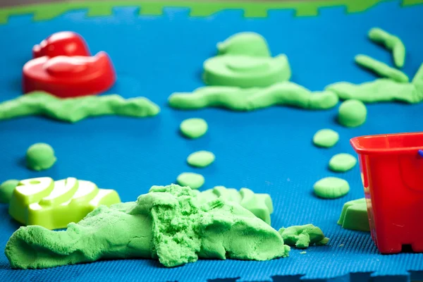 INTERESTING, NEW GAME IN KINETIC SAND OF THE HOUSE Royalty Free Stock Images