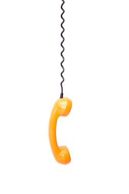 Beyaz arka plan üzerinde izole turuncu retro telefon tüp.