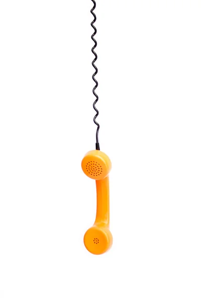 Oranžový retro telefon trubky izolované na bílém pozadí. — Stock fotografie