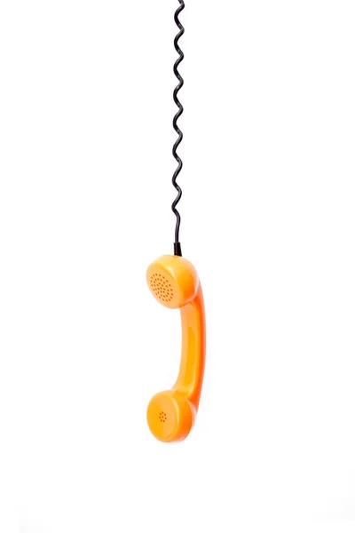 Beyaz arka plan üzerinde izole turuncu retro telefon tüp.