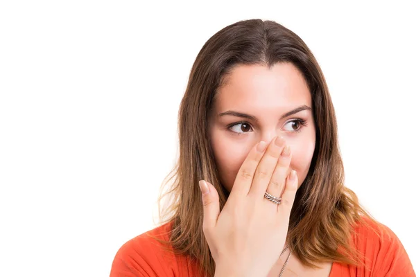 Surprised young woman covering mouth — Stock Photo, Image