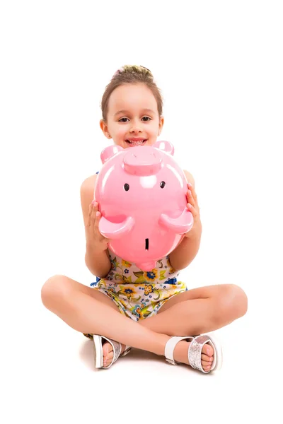 Young girl with a new piggy bank — Stock Photo, Image