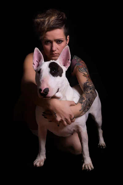 Tattooed Woman and bull terrier — Stock Photo, Image