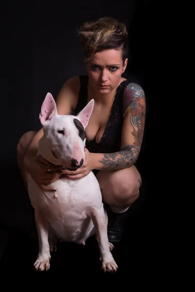 Tattooed Woman and bull terrier — Stock Photo, Image