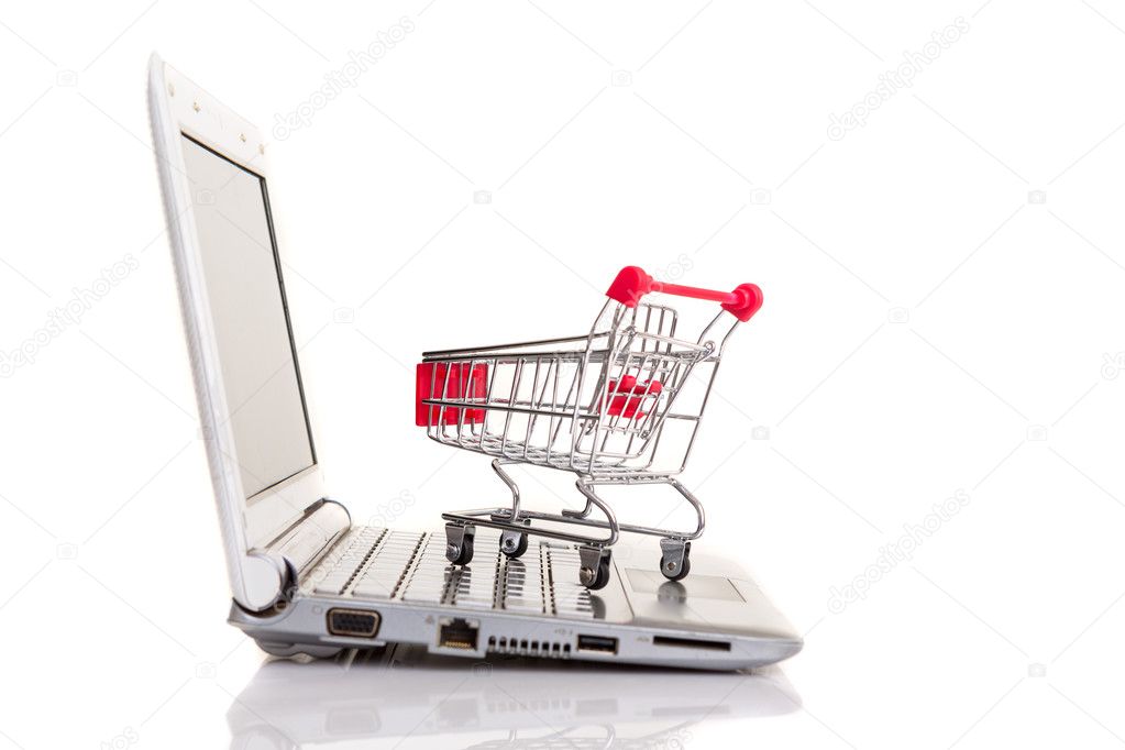 Shopping cart over a laptop