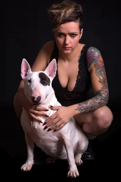 Tattooed Woman and bull terrier — Stock Photo, Image