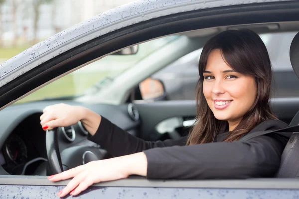 Woman driving new car Royalty Free Stock Images