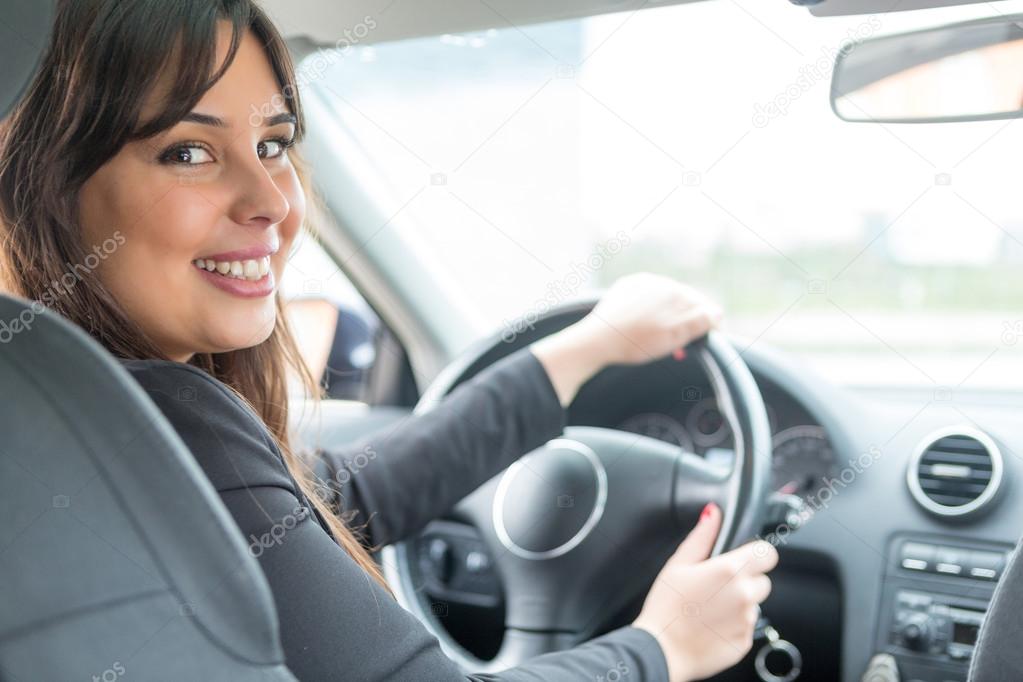 Woman driving her new  car