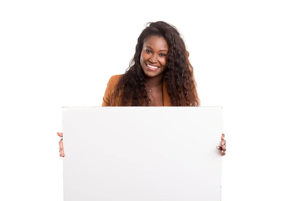 Beautiful african woman presenting product — Stock Photo, Image