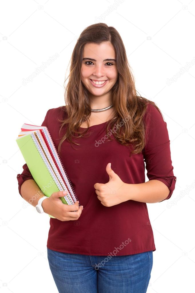 Young student girl gesturing thumb up sign