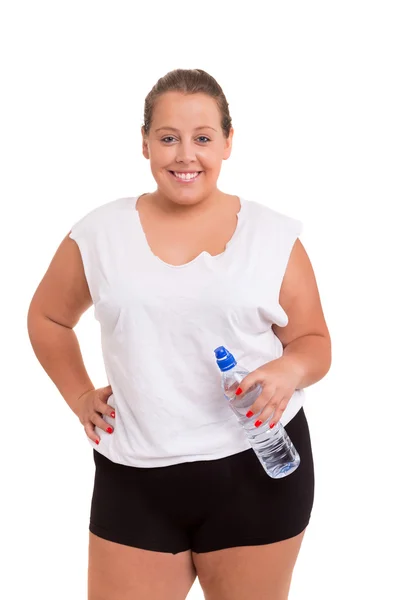 Stora kvinna tränar med flaska vatten — Stockfoto