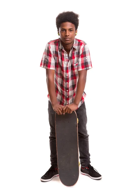 Skater boy posing with skateboard — Stock Photo, Image