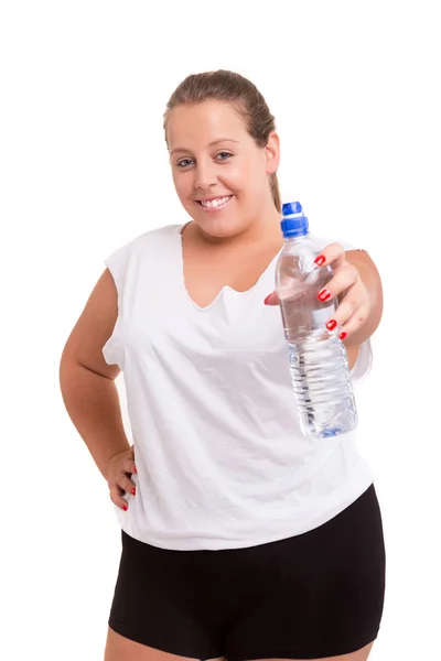 Große Frau, die mit einer Flasche Wasser trainiert — Stockfoto