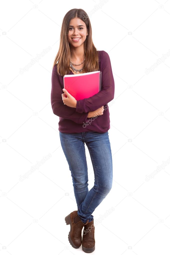 Student standing with notebooks