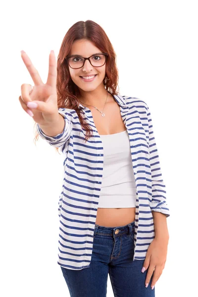 Woman gesturing victory sign — Stock Photo, Image