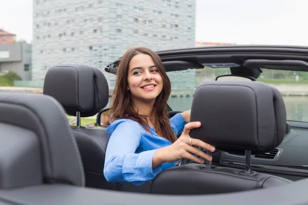 Businesswoman driving her new sports car — Stock Photo, Image