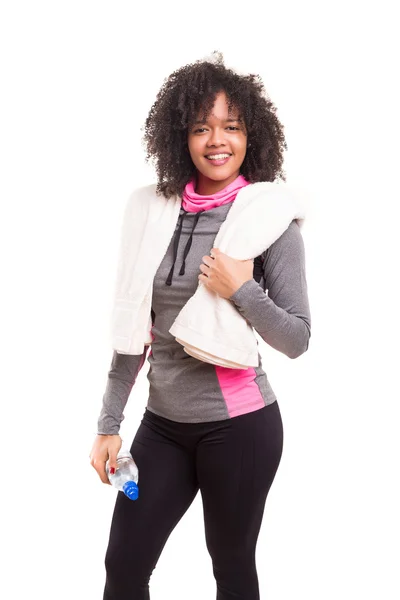 African woman with towel and bottle of water — Stock Photo, Image