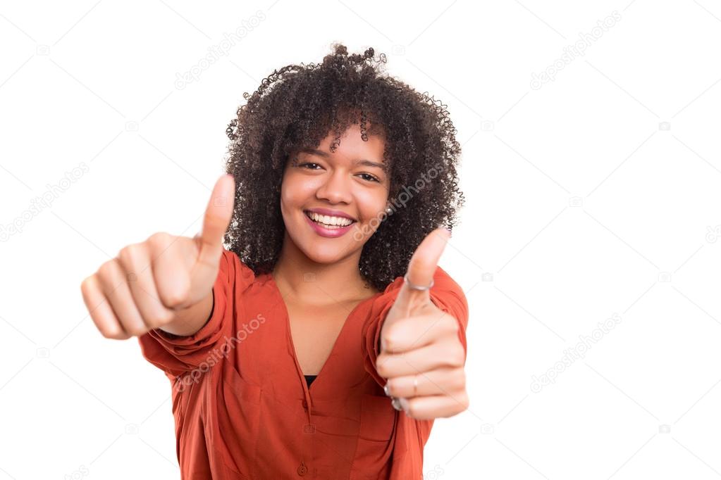 Woman gesturing thumbs up sign,