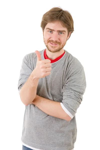 Young casual man going thumbs up, isolated on white background — Stock Photo, Image