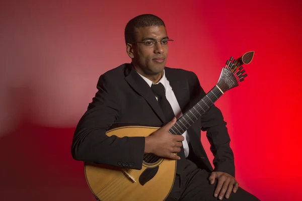 Fado musician with a portuguese guitar, studio — Stock Photo, Image